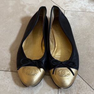 CHANEL Black and Gold Cap Toe Flats
